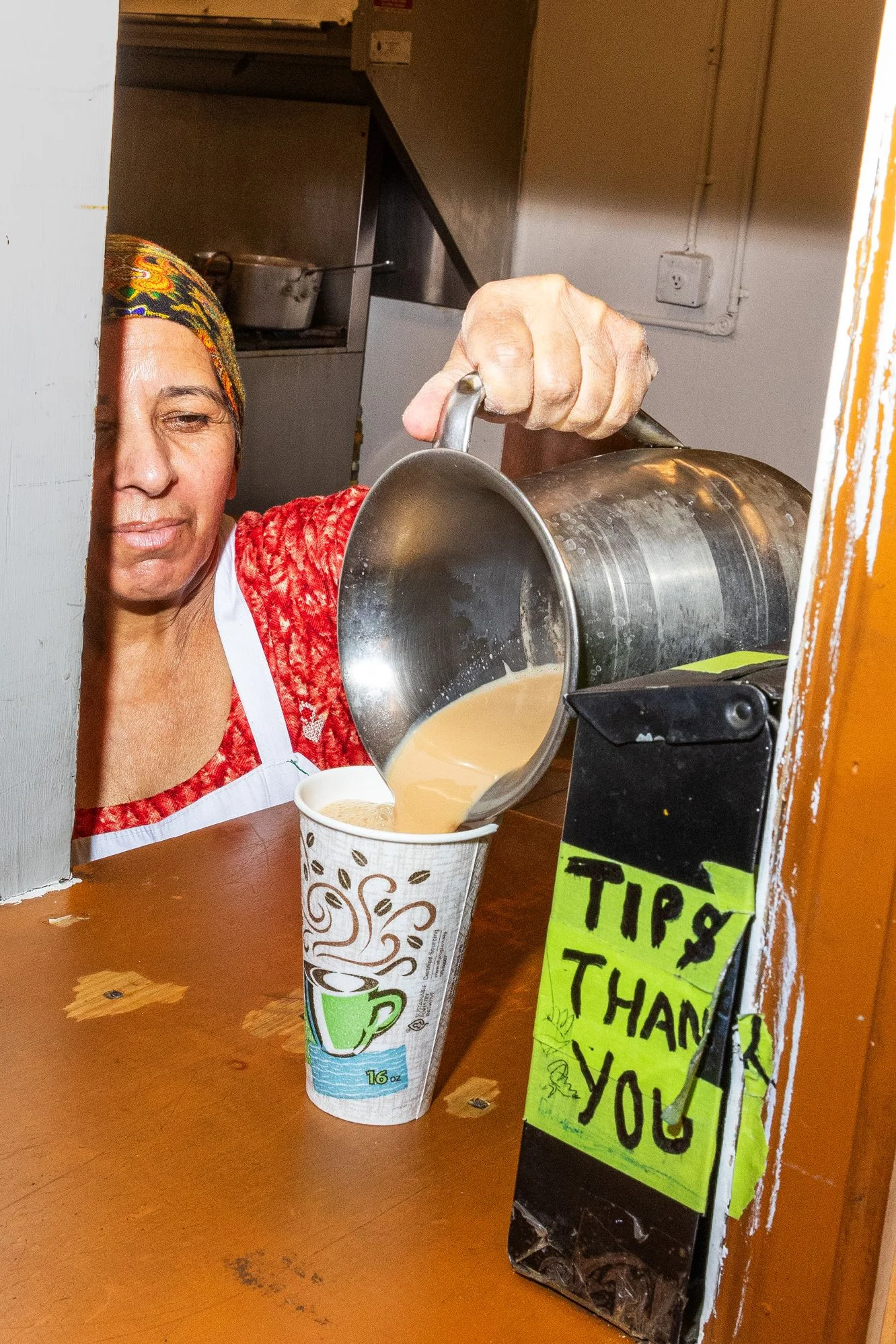 Line cook Kalbinder Kaus brews 10 to 12 gallon jugs of hot chai per day.