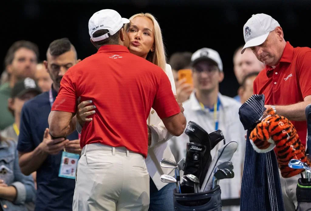 Vanessa Trump kissing Tiger Woods